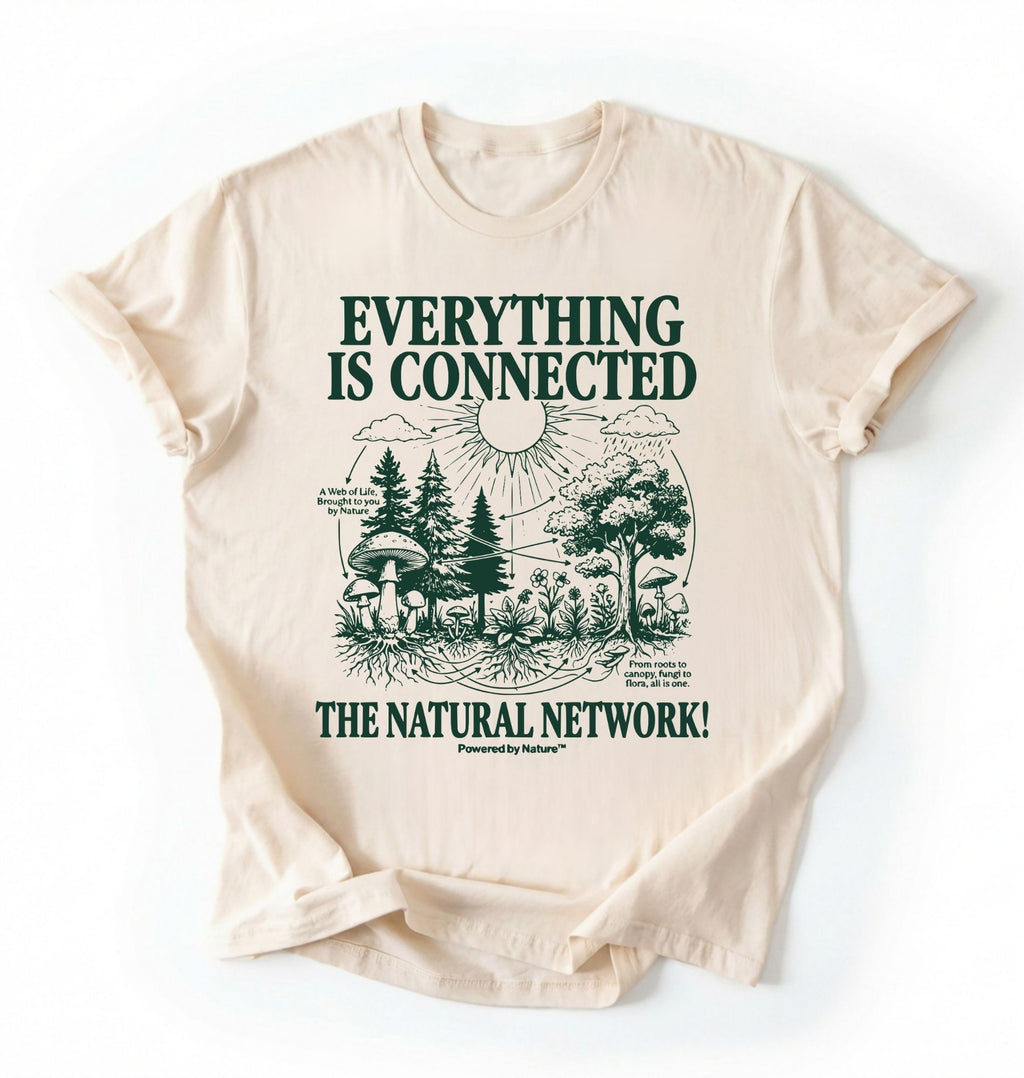 Flat lay of a natural t-shirt featuring a forest and fungi illustration with text reading “Everything Is Connected The Natural Network.” perfect gift for nature lovers and eco friendly lifestyle on a white background 