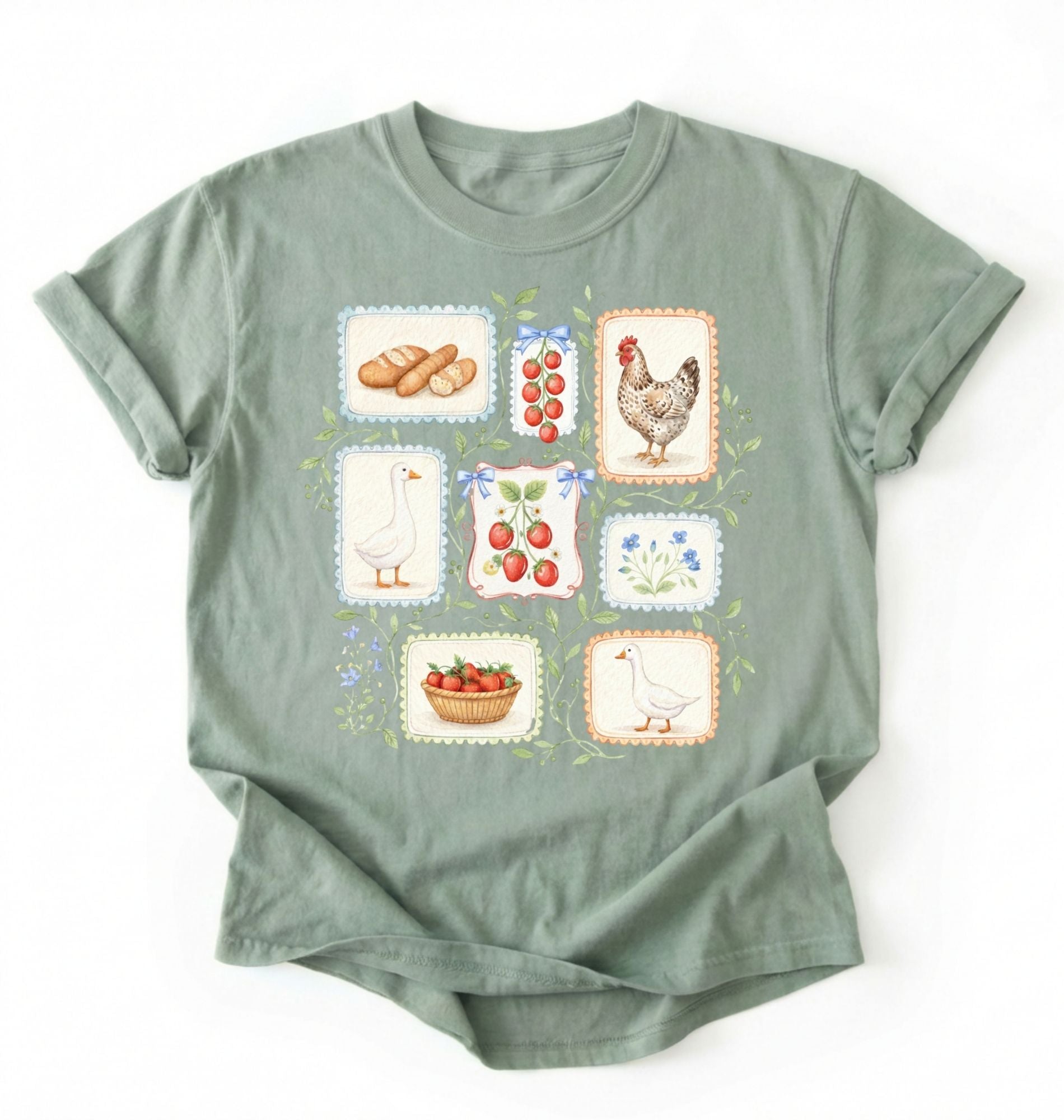 Flat lay of a Bay_Sage t-shirt featuring vintage-style illustrations of bread, eggs, fruit, and chickens arranged in a grid pattern perfect homestead gardener gift for farm life lovers on a white background 
