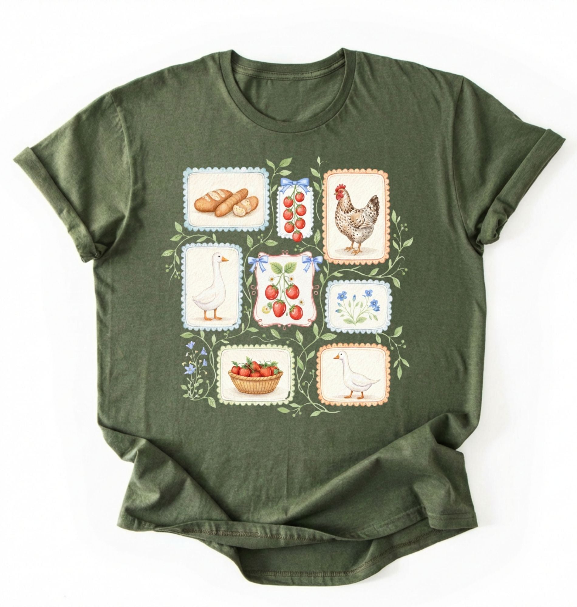 Flat lay of a Moss MilitaryGreen t-shirt featuring vintage-style illustrations of bread, eggs, fruit, and chickens arranged in a grid pattern perfect homestead gardener gift for farm life lovers on a white background 