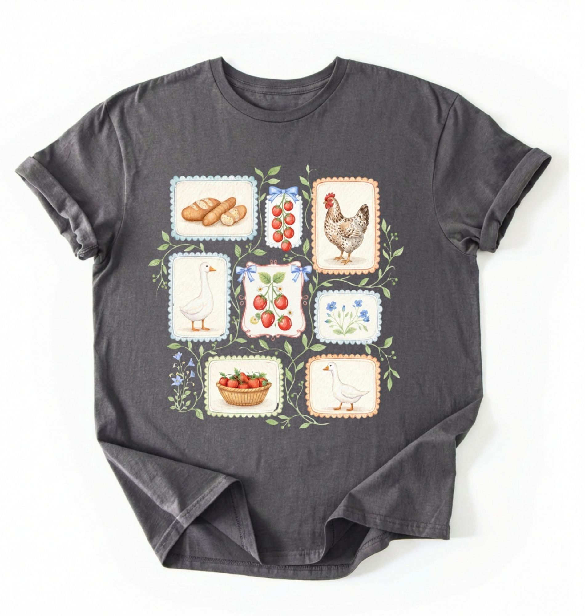 Flat lay of a Charcoal t-shirt featuring vintage-style illustrations of bread, eggs, fruit, and chickens arranged in a grid pattern perfect homestead gardener gift for farm life lovers on a white background 