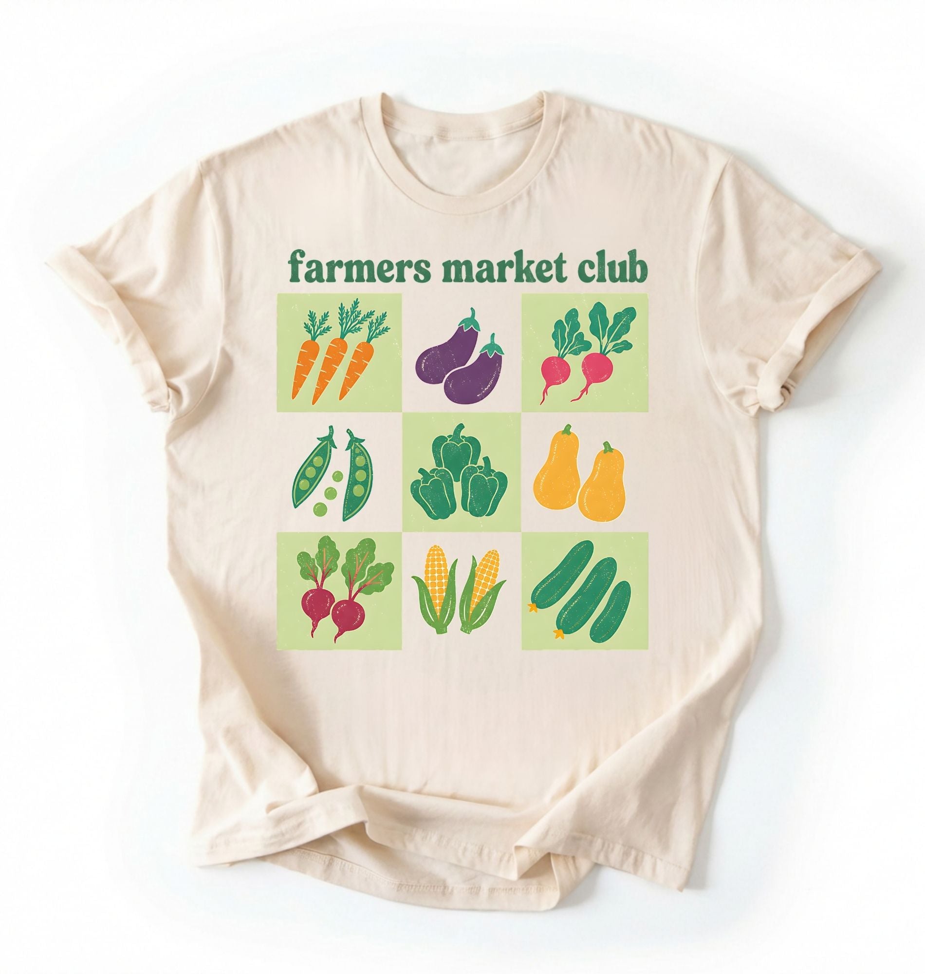Flat lay of a beige farmers market club shirt white vegetable gardening t shirt cottagecore farmer market gift on a white background 