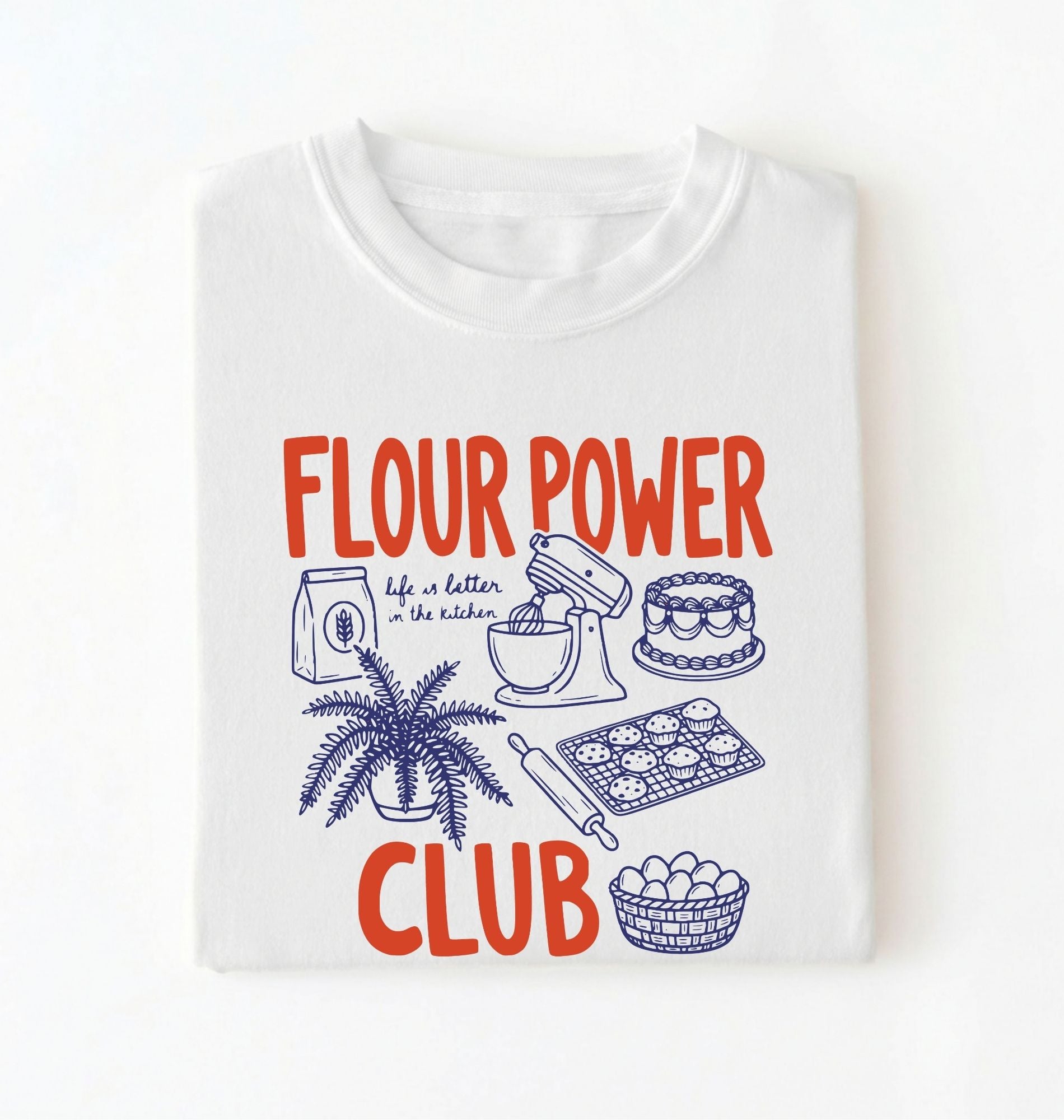 Flat lay of a white flour power club shirt with stand mixer cake cookies and baking illustrations funny baker gift on a white background 