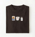 Flat lay of a brown flour water salt shirt with flour bag measuring cup and salt shaker minimalist bread baker gift on a white background 