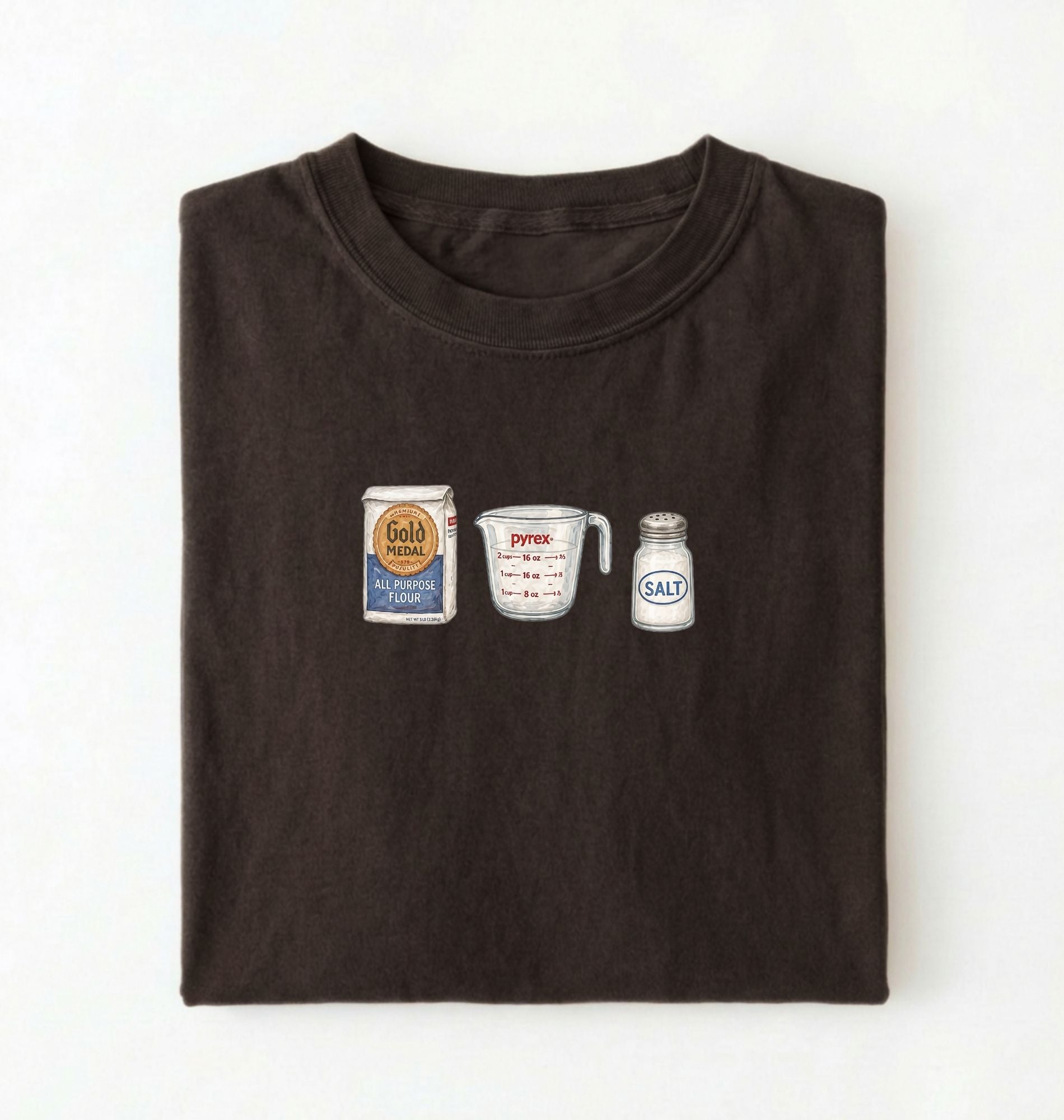 Flat lay of a brown flour water salt shirt with flour bag measuring cup and salt shaker minimalist bread baker gift on a white background 