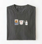 Flat lay of a gray flour water salt shirt with flour bag measuring cup and salt shaker minimalist bread baker gift on a white background 