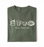 Flat lay of a green flour water salt shirt cream minimalist baking t shirt bread lover gift sourdough aesthetic design on a white background 
