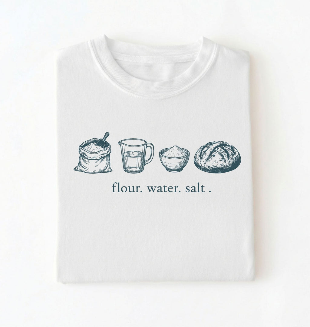 Flat lay of a white flour water salt shirt cream minimalist baking t shirt bread lover gift sourdough aesthetic design on a white background 