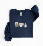Flat lay of a navy blue flour water salt sweatshirt with flour bag measuring cup and salt shaker for bread bakers on a white background 