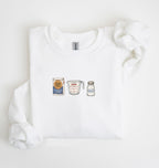 Flat lay of a white flour water salt sweatshirt with flour bag measuring cup and salt shaker for bread bakers on a white background 