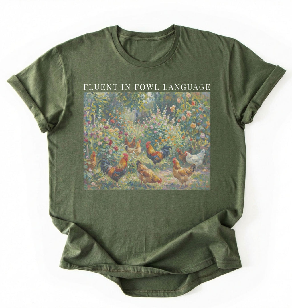 Flat lay of a Moss_Military Funny Fluent in Fowl Language shirt for chicken lovers and farm animal fans on a white background