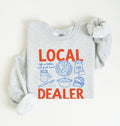 Flat lay of an ash cottagecore baking sweatshirt with Local Dealer text and bread graphics gift for bakers on a white background 