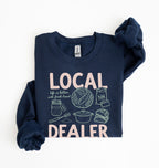 Flat lay of an navy cottagecore baking sweatshirt with Local Dealer text and bread graphics gift for bakers on a white background 