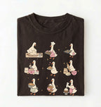 Flat lay of a Cute goose baking shirt with cottagecore bread baking illustrations on brown tee on a white background 