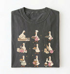 Flat lay of a Cute goose baking shirt with cottagecore bread baking illustrations on pepper tee on a white background 