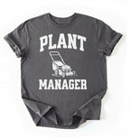 Flat lay of a pepper Gardening dad shirt featuring bold varsity style Plant Manager text on a white background 