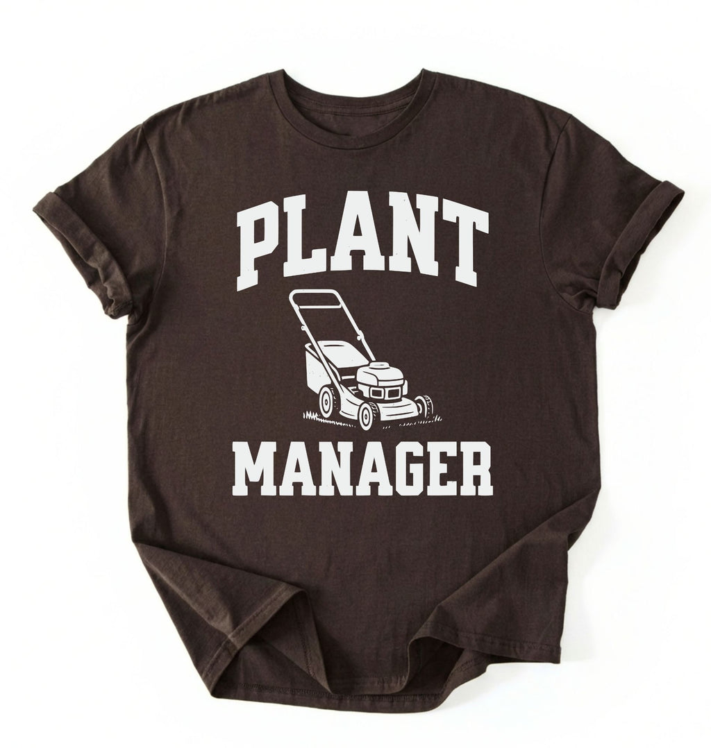 Flat lay of a brown Gardening dad shirt featuring bold varsity style Plant Manager text on a white background 