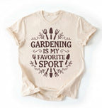 Flat lay of an ivory Gardening is my favorite sport shirt with garden tools design perfect gift for gardeners and plant lovers on a white background