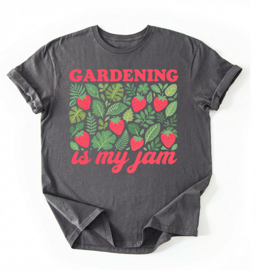 Flat lay of a Charcoal gardening is my jam shirt white funny plant lover t shirt cute strawberry garden gift on a white background 