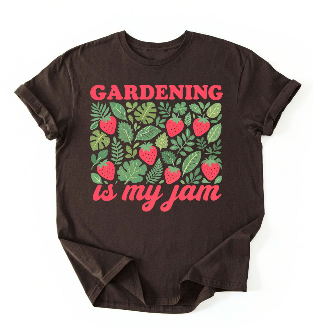 Flat lay of a dark chocolate gardening is my jam shirt white funny plant lover t shirt cute strawberry garden gift on a white background 