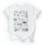 Flat lay of a white Gardening tools shirt with plants pots and garden equipment design perfect gift for gardeners and plant lovers on a white background