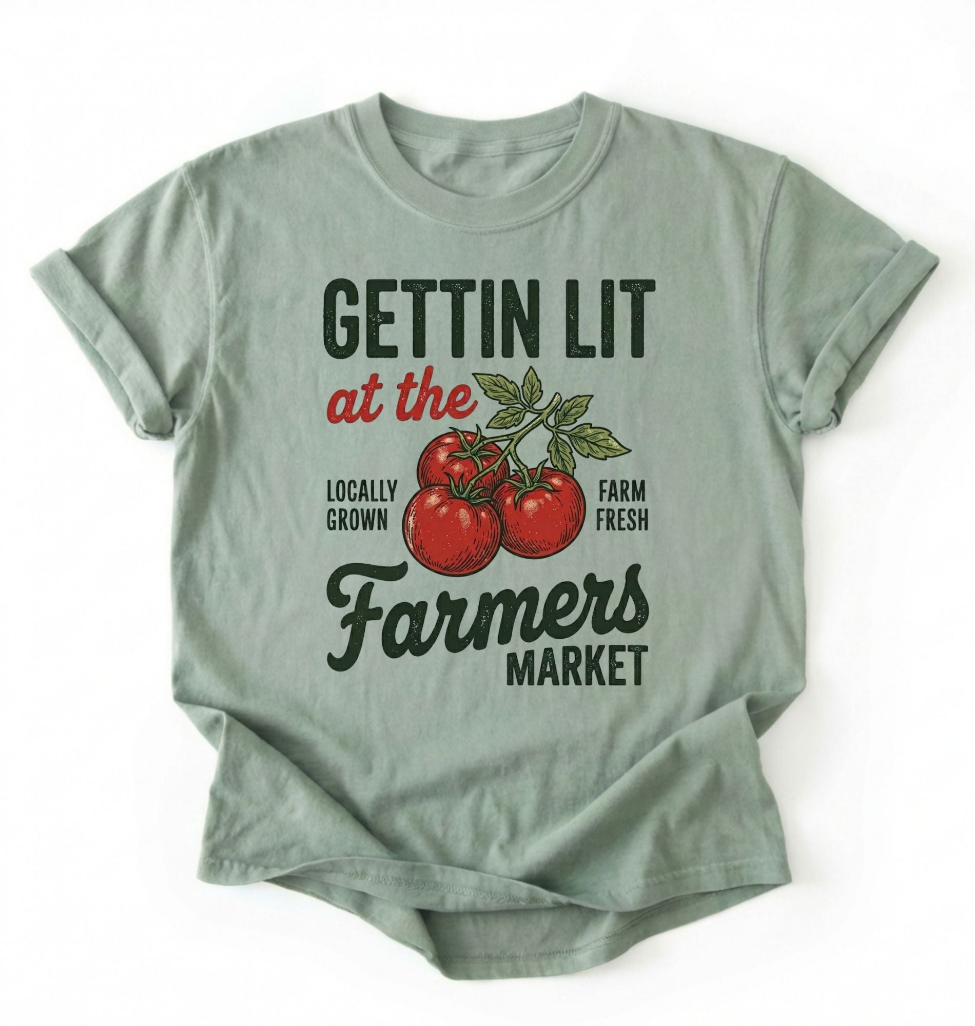 Flat lay of a bay t-shirt featuring tomatoes and text reading “Gettin Lit at the Farmers Market Locally Grown Farm Fresh.” Funny farmers market shirt pun perfect gift for gardeners homesteaders and vegetable lovers on a white background 
