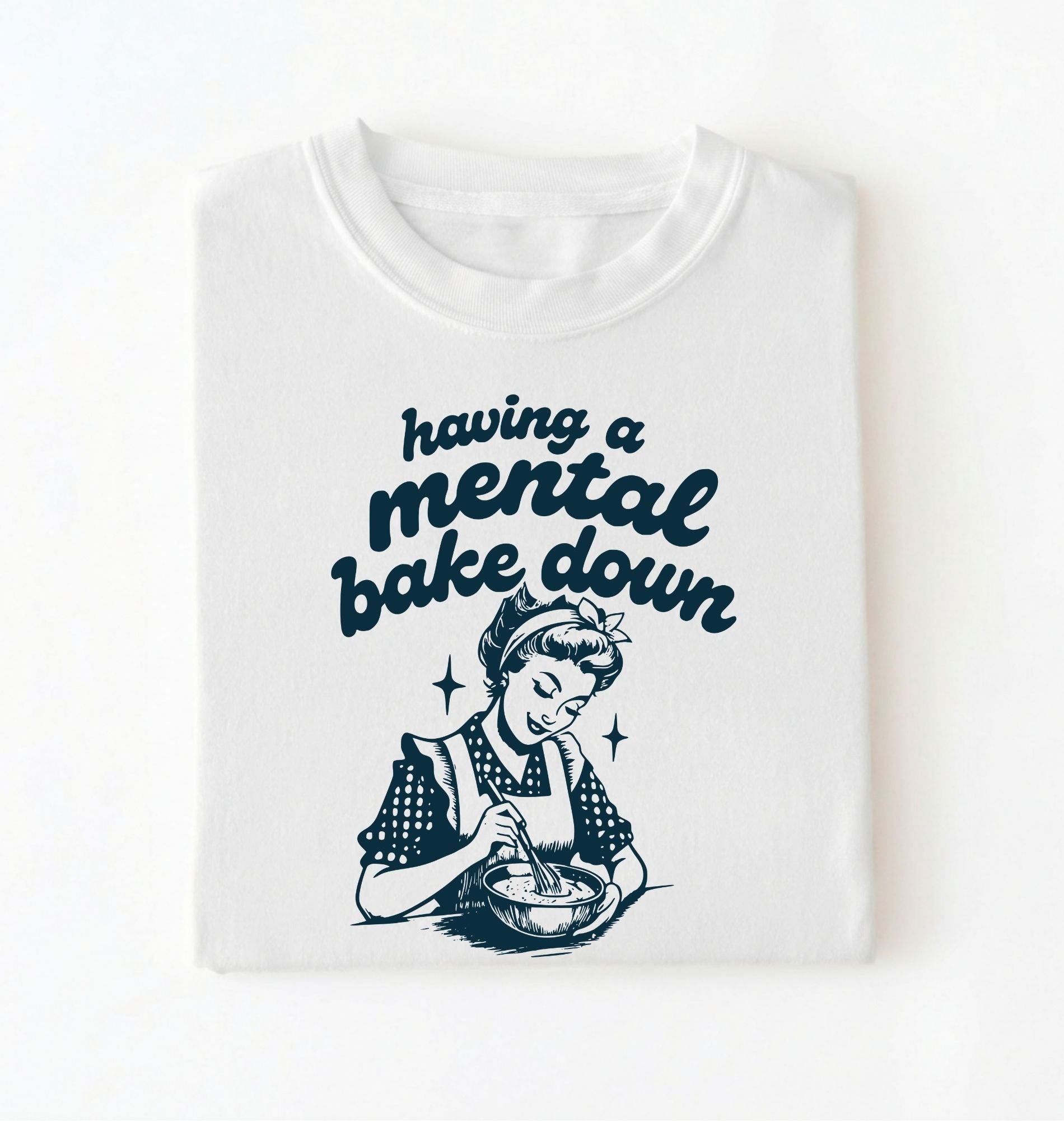 Flat lay of a white having a mental bake down shirt with vintage baker illustration funny baking lover gift on a white background 