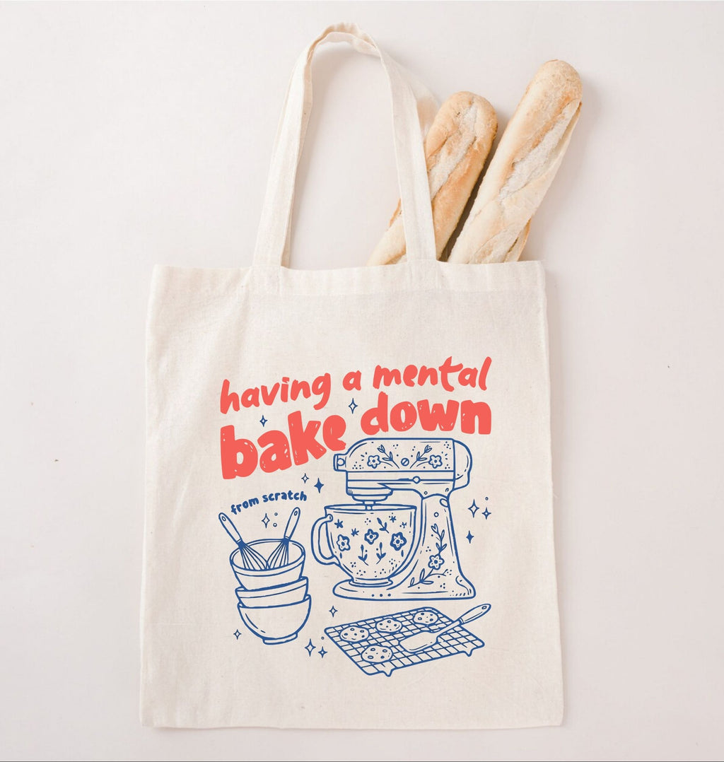 Tote bag with baking-themed design and text 'having a mental bake down' on a white background