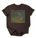 Flat lay Espresso mushroom shirt with vintage forest artwork and text Hold Up I See Mushrooms, cottagecore gardener gift