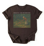 Flat lay Espresso mushroom shirt with vintage forest artwork and text Hold Up I See Mushrooms, cottagecore gardener gift