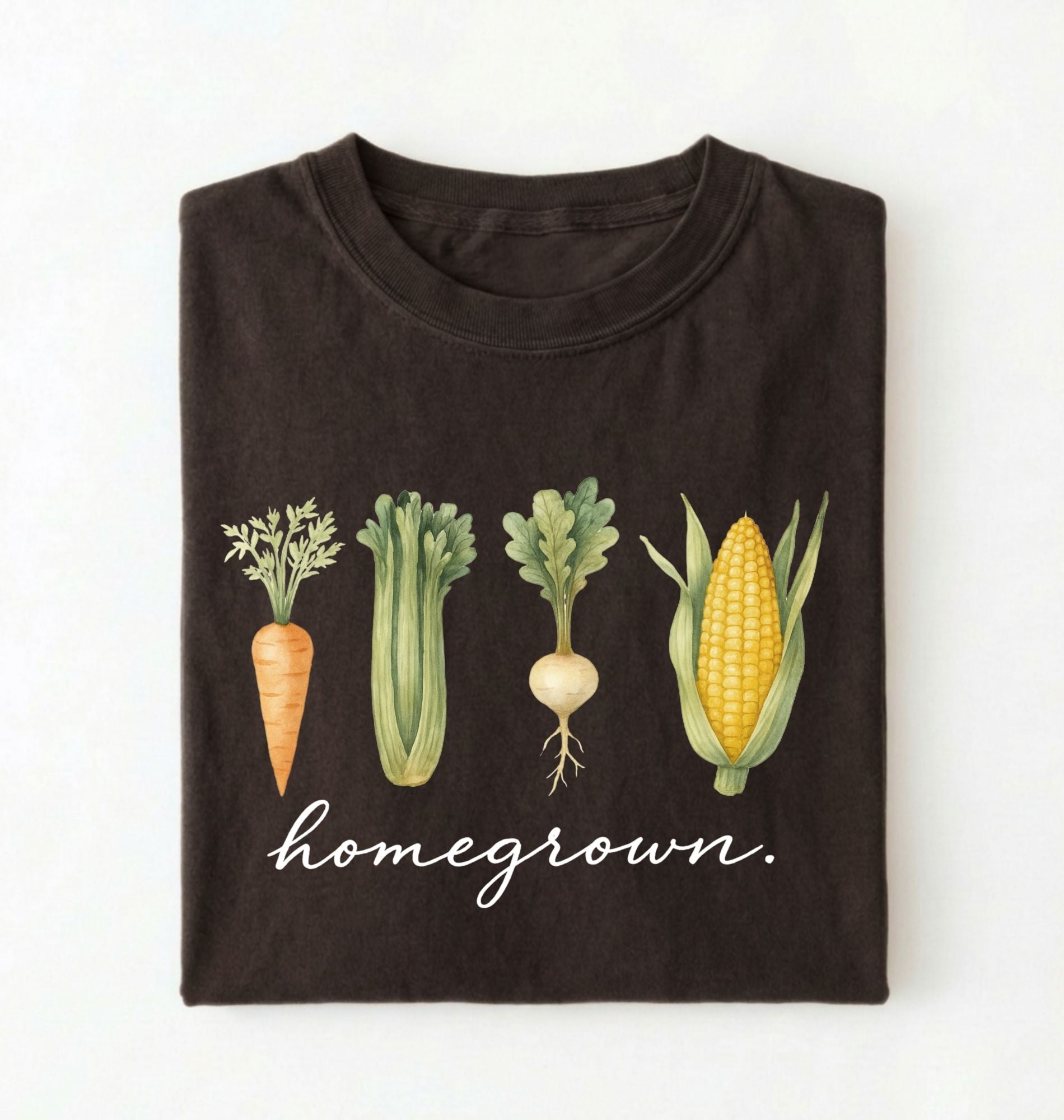 Flat lay of a dark chocolate homegrown vegetable t shirt with illustrated carrot celery turnip and corn gardener gift on a white background