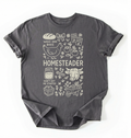 Flat lay of a charcoal homesteader shirt with chicken farm garden and baking icons cottagecore aesthetic gift white t-shirt on a white backgroud