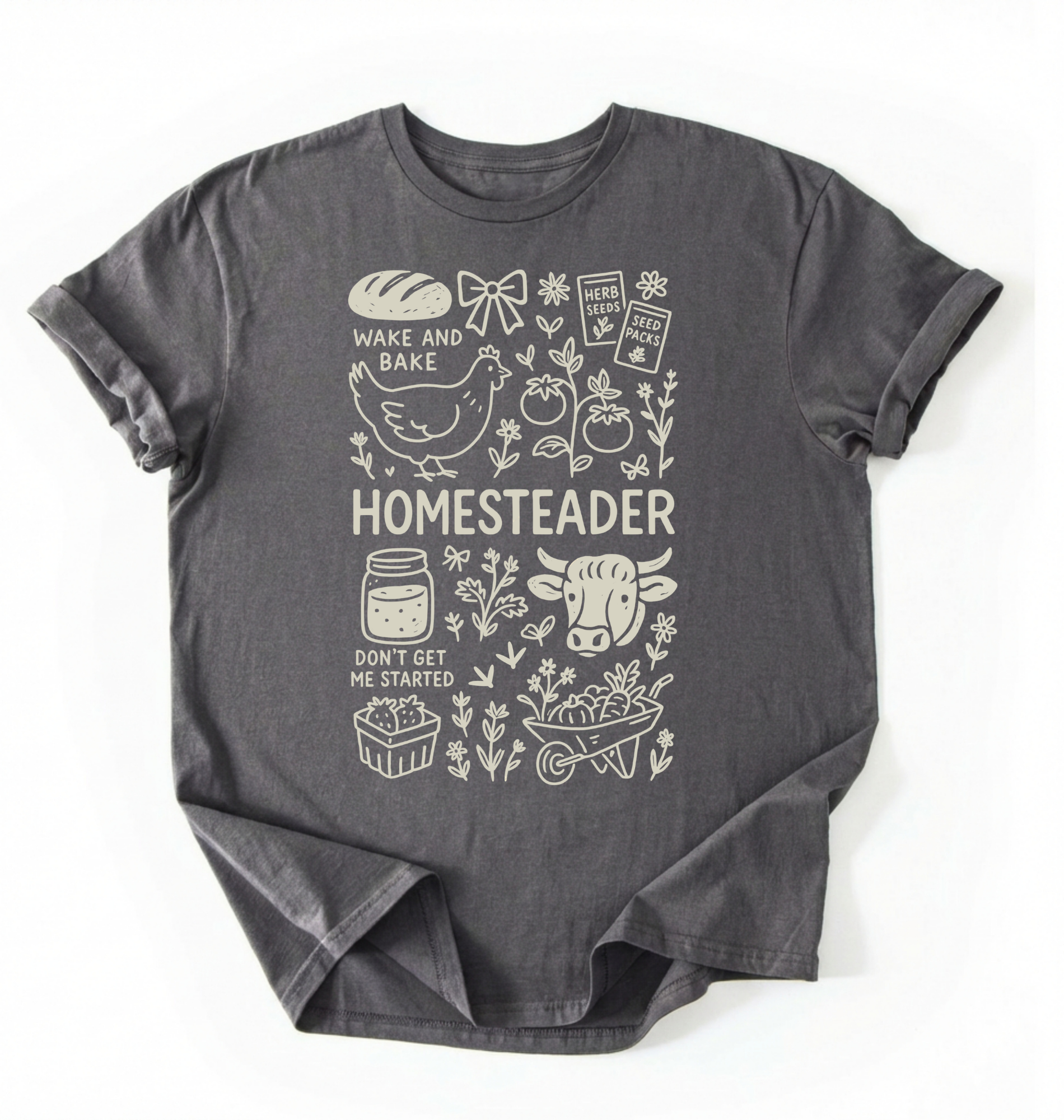 Flat lay of a charcoal homesteader shirt with chicken farm garden and baking icons cottagecore aesthetic gift white t-shirt on a white backgroud