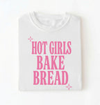 Flat lay of a white hot girls bake bread shirt with pink text funny sourdough baker gift black t-shirt on a white background 