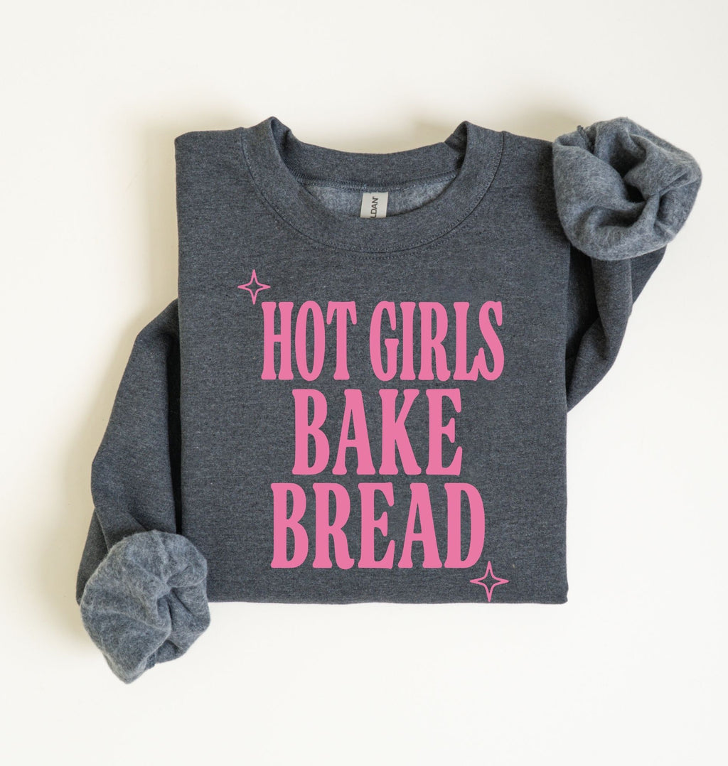 Flat lay of an dark heather Hot Girls Bake Bread graphic sweatshirt for sourdough lovers and home bread bakers on a white background 