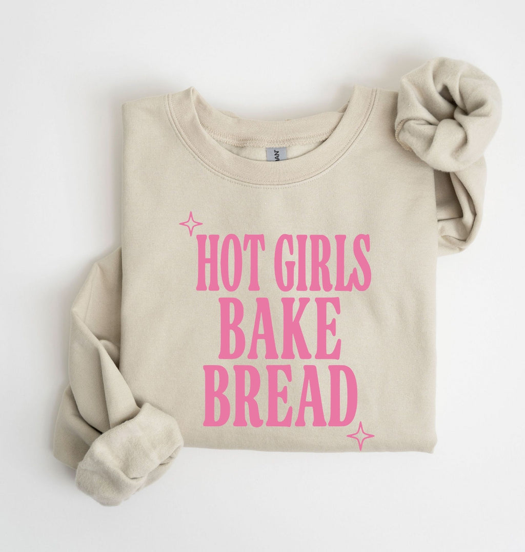 Flat lay of an sand Hot Girls Bake Bread graphic sweatshirt for sourdough lovers and home bread bakers on a white background 
