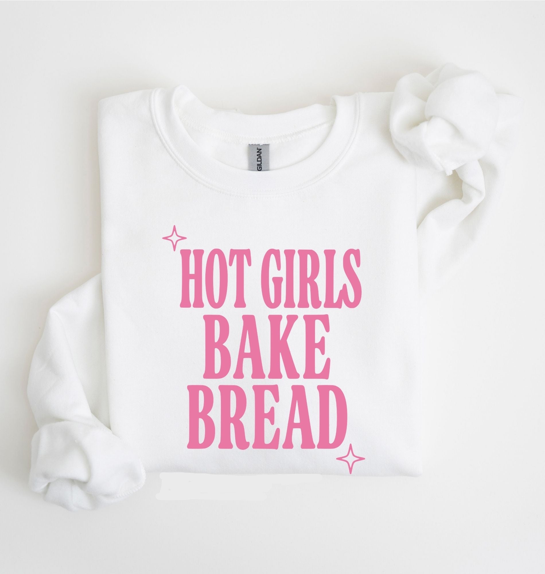 Flat lay of an white Hot Girls Bake Bread graphic sweatshirt for sourdough lovers and home bread bakers on a white background 
