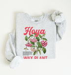 Flat lay of a ash crewneck sweatshirt displaying a detailed botanical illustration labeled “Hoya Wax Plant.
