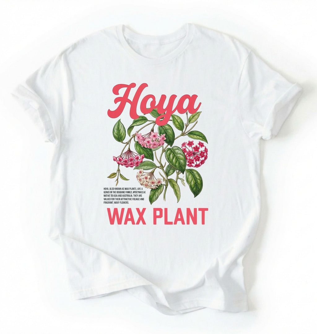 Flat lay of a white t-shirt featuring a detailed botanical illustration labeled “Hoya Wax Plant” with flowers and leaves.
