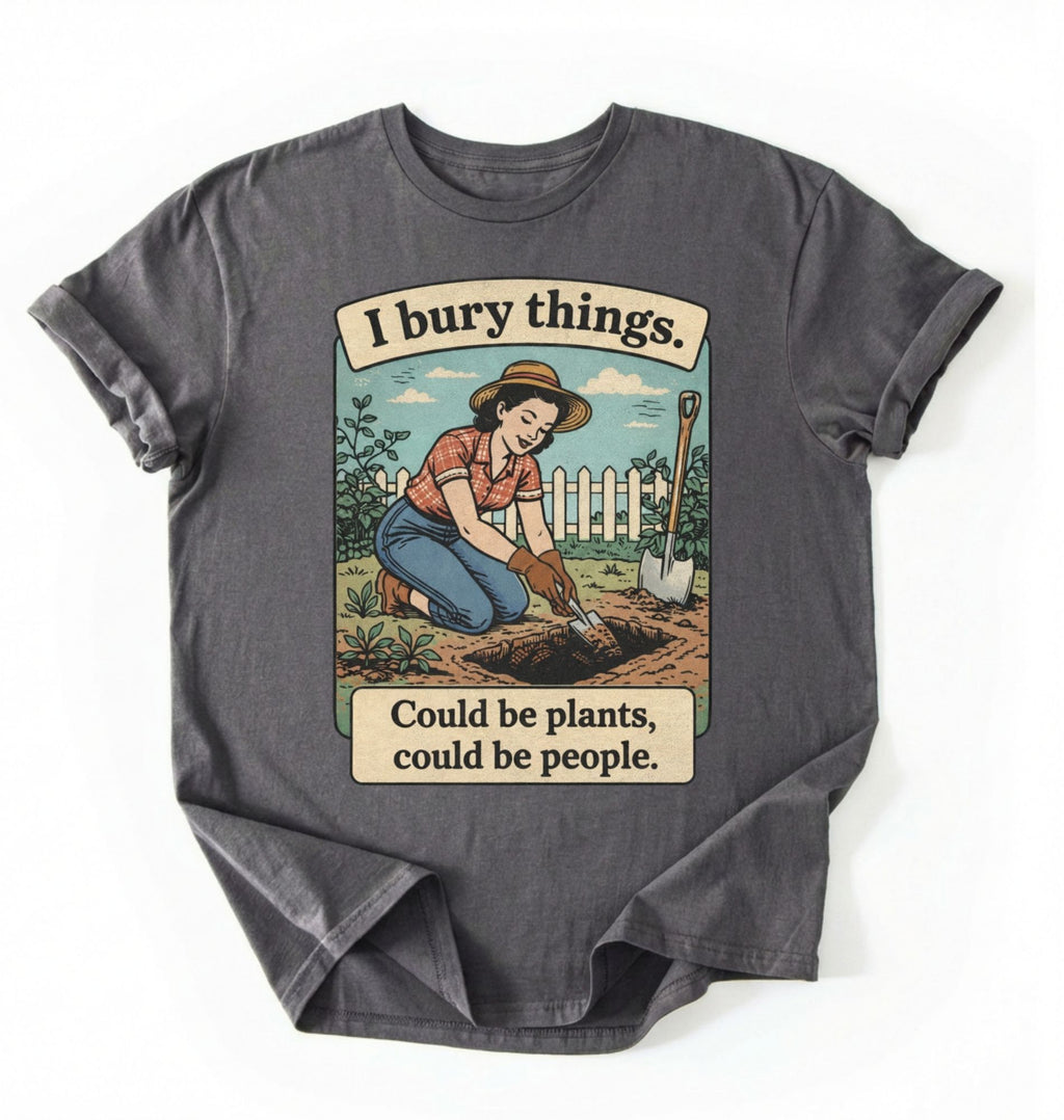 Flat lay of a charcoal Funny I bury things gardening shirt with vintage illustration perfect gift for gardeners and plant lovers with humor on a white background