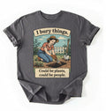Flat lay of a charcoal Funny I bury things gardening shirt with vintage illustration perfect gift for gardeners and plant lovers with humor on a white background