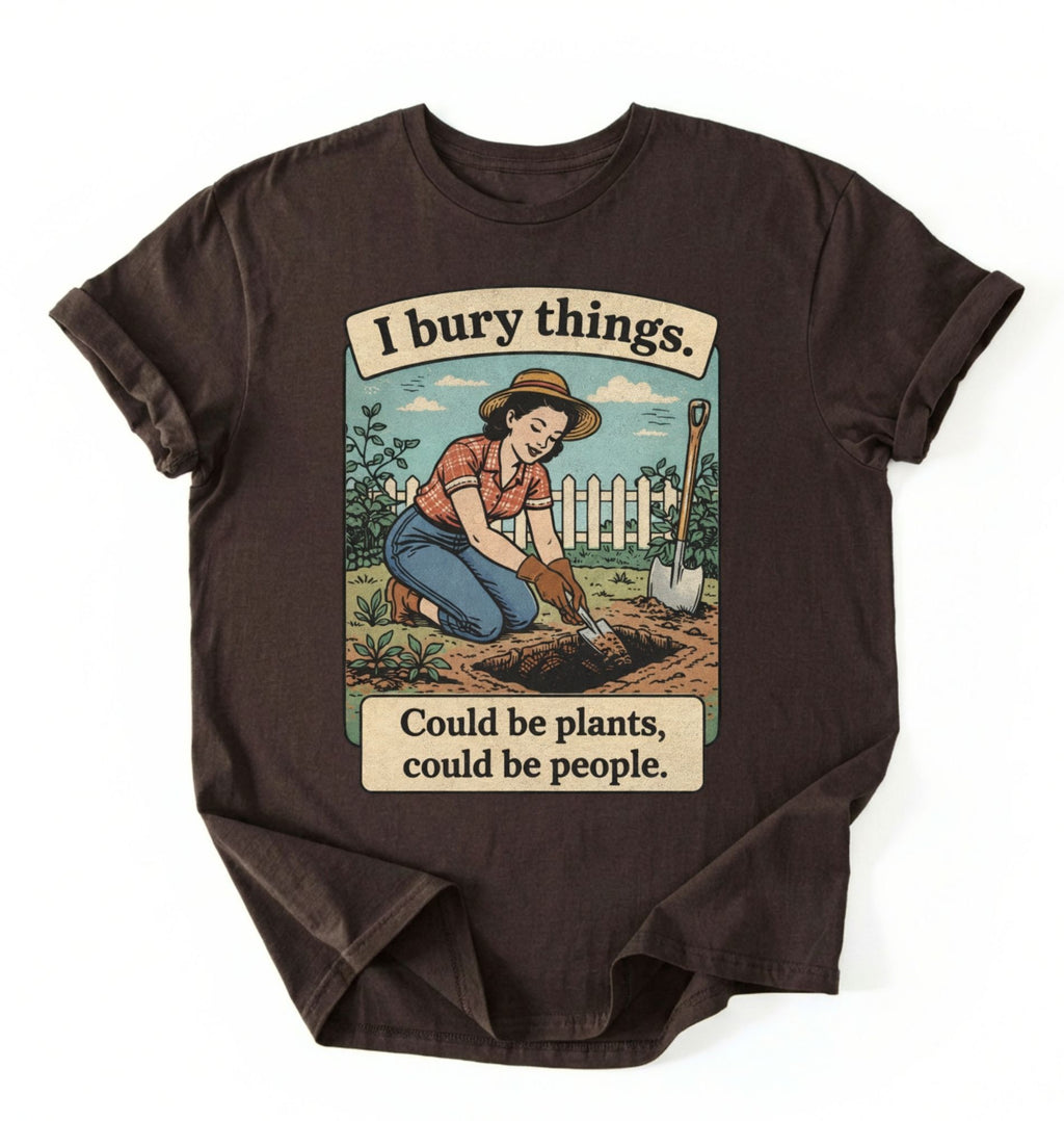 Flat lay of a dark chocolate Funny I bury things gardening shirt with vintage illustration perfect gift for gardeners and plant lovers with humor on a white background 