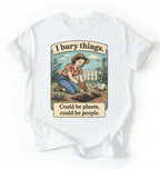 Flat lay of a white Funny I bury things gardening shirt with vintage illustration perfect gift for gardeners and plant lovers with humor on a white background