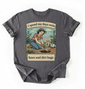 Flat lay of a charcoal Funny gardening shirt with hoes and dirt bags text perfect for gardeners and plant lovers with humor on a white background