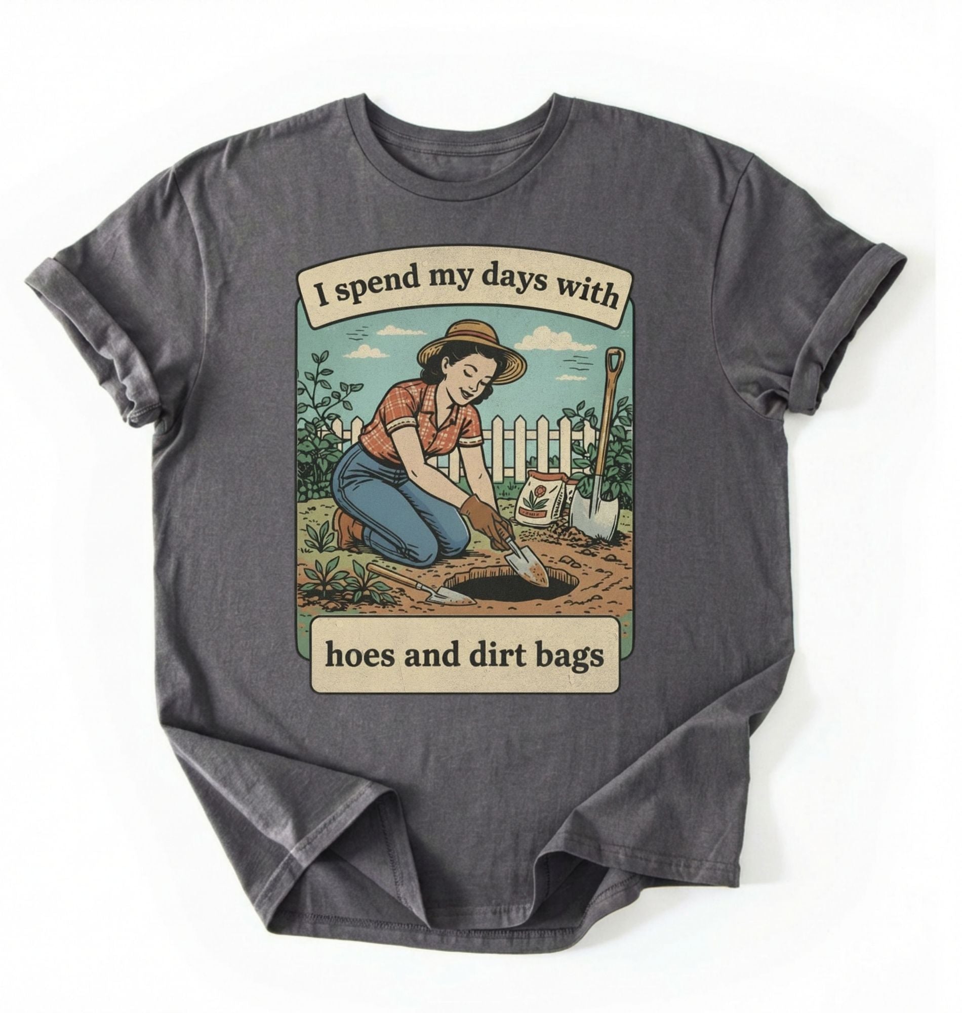 Flat lay of a charcoal Funny gardening shirt with hoes and dirt bags text perfect for gardeners and plant lovers with humor on a white background