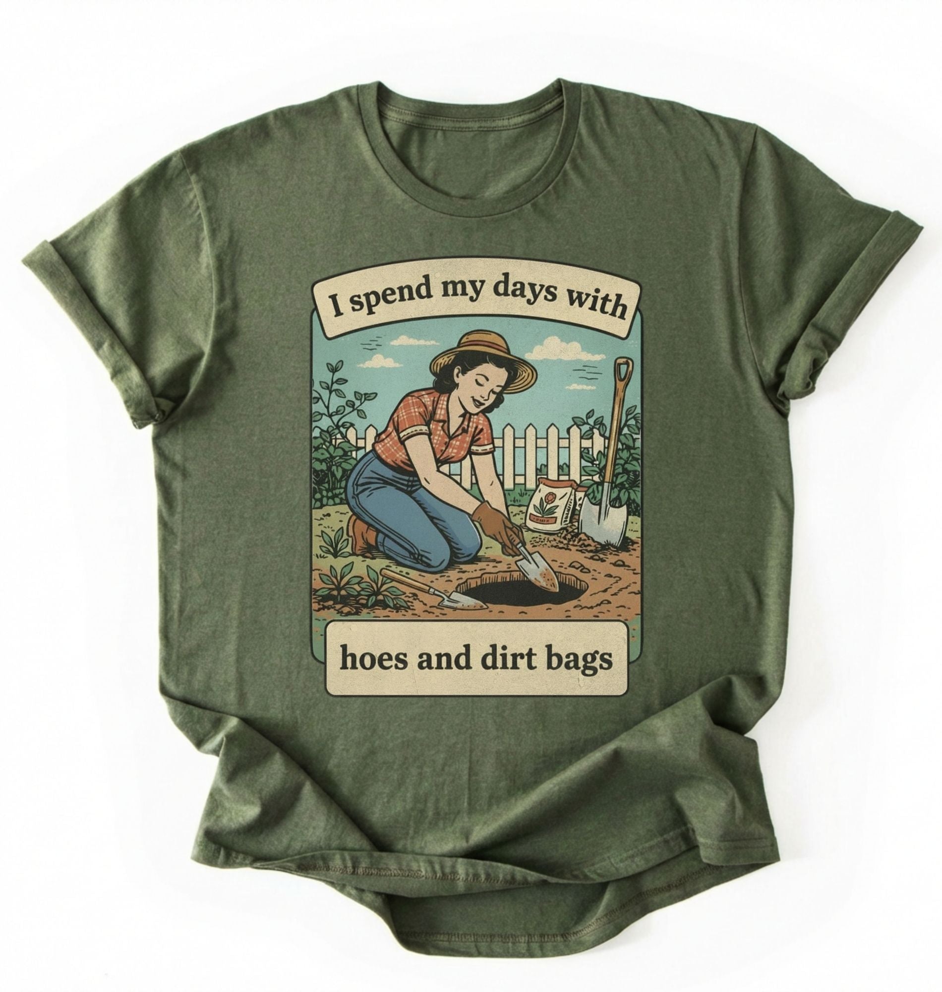 Flat lay of a moss Funny gardening shirt with hoes and dirt bags text perfect for gardeners and plant lovers with humor on a white background