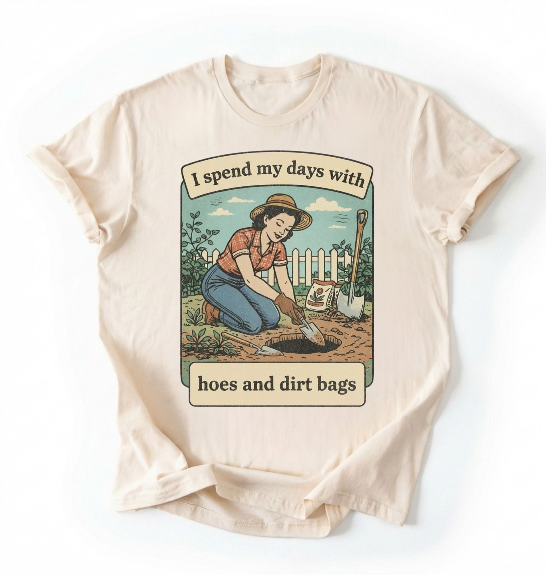 Flat lay of an ivory Funny gardening shirt with hoes and dirt bags text perfect for gardeners and plant lovers with humor on a white background