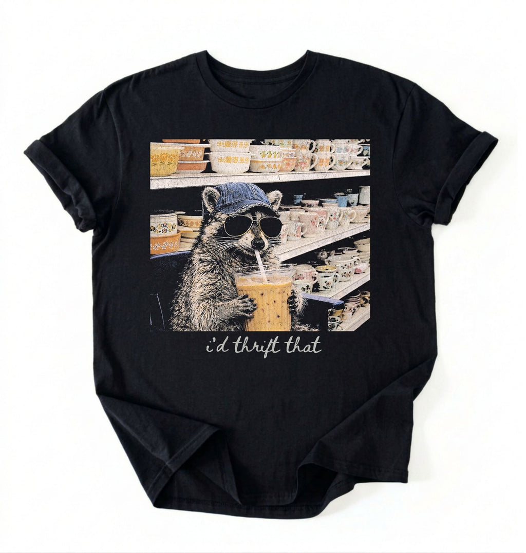Flat lay of a id thrift that raccoon shirt black funny thrift shopping t shirt vintage lover gift on a white background 