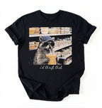 Flat lay of a id thrift that raccoon shirt black funny thrift shopping t shirt vintage lover gift on a white background 