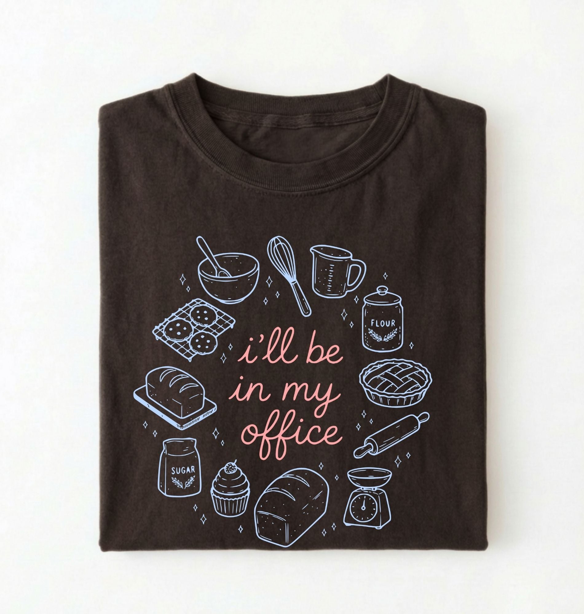 Flat lay of a Funny baking shirt with bread pie cupcake and baking tools illustration on darkchocolate tee on a white background 