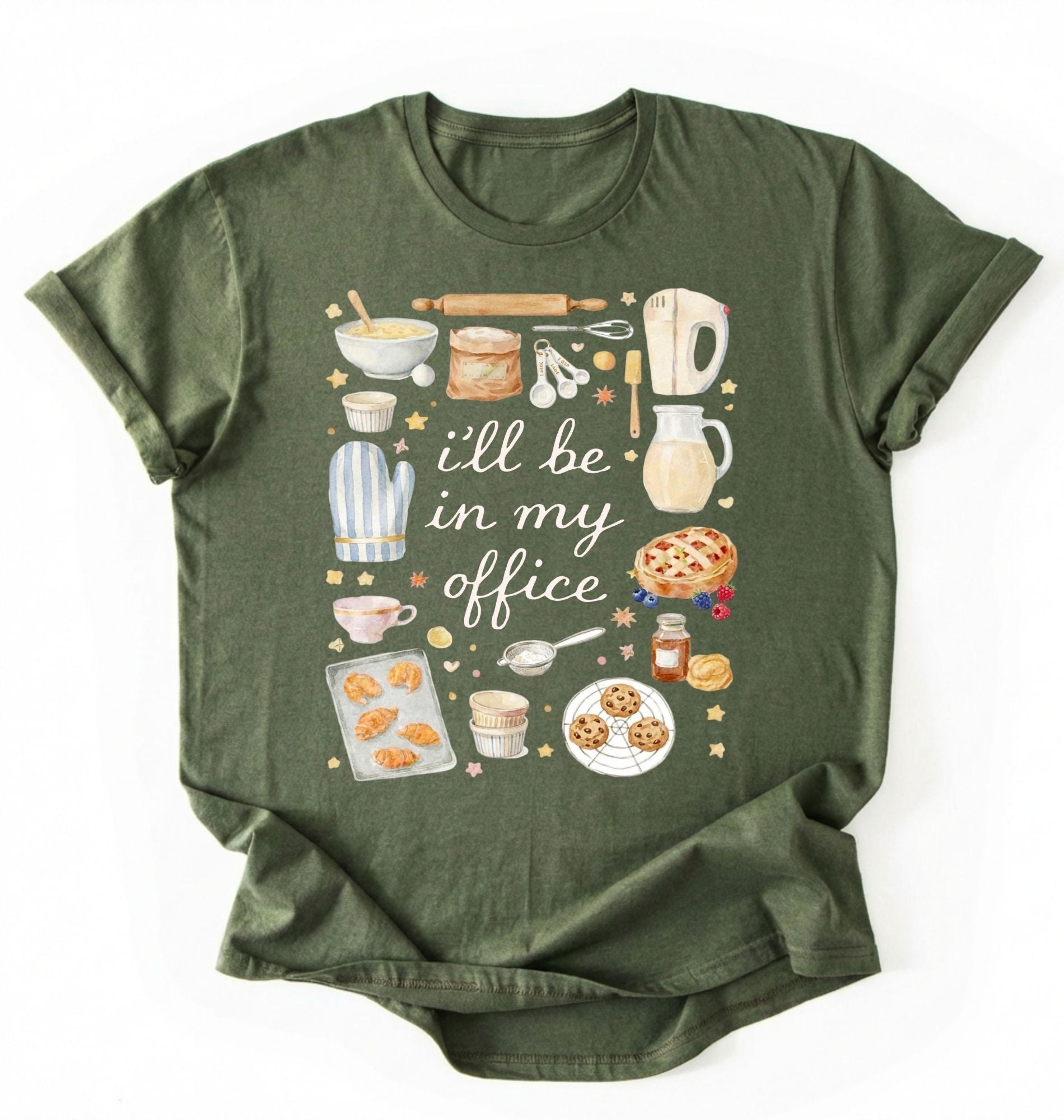 Flat lay of a moss Baking shirt with tools and desserts saying ill be in my office perfect gift for bakers and home baking lovers on a white background